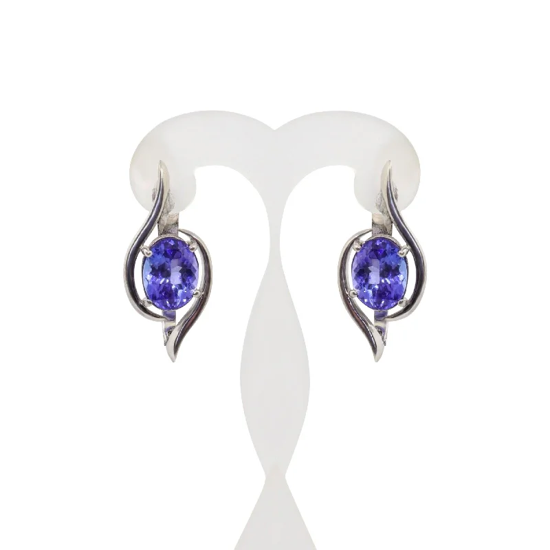 women's earrings huggie hoop -18 kt White Gold Four Claw Oval Tanzanite Swirl Earrings